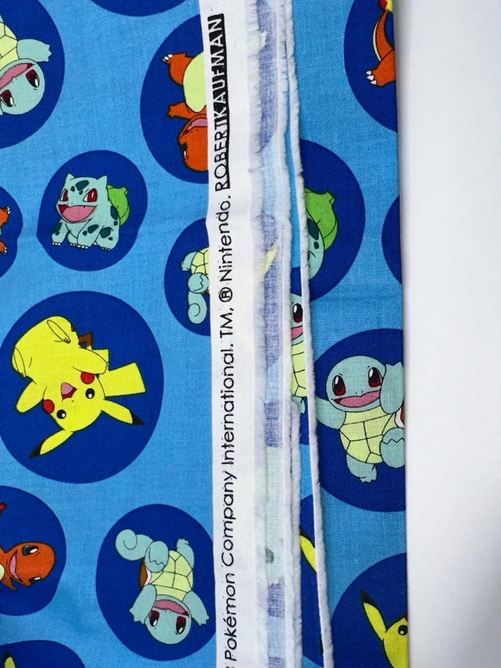 Pokémon Blue Pikachu, Squirtle & Bulbasaur Patterned Fabric by Robert Kaufman